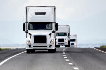 picture of a fleet of trucks driving along the highway